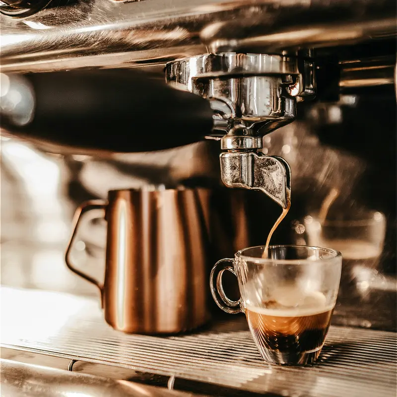Coffee machine making espresso. Photograph by Jonathan Borba, Unsplash.